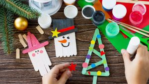 A bunch of festive christmas activities on a wooden bench
